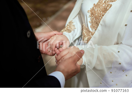 National wedding. Bride and groom. Wedding muslim couple during the marriage ceremony. Muslim marriage. National wedding. Bride and groom. Wedding muslim couple during the marriage ceremony. Muslim marriage. 91077163