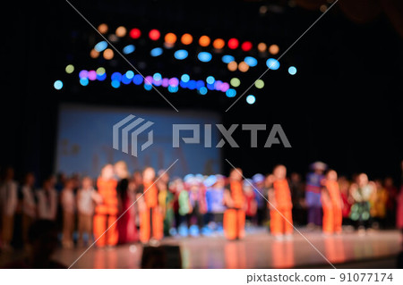 De-focused concert crowd. Young people dancing in night club party. selective focus. Long exposure. Moving lights. De-focused concert crowd. Young people dancing in night club party. selective focus. Long exposure. Moving lights. 91077174