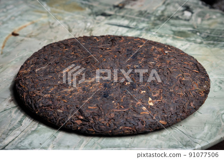 Pu-erh fermented Chinese tea in a roll. 91077506
