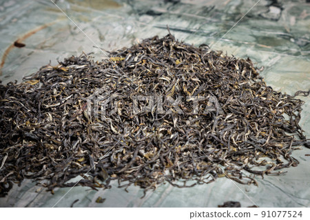 Pu-erh fermented Chinese tea in a roll. 91077524