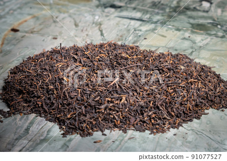 Pu-erh fermented Chinese tea in a roll. Pu-erh fermented Chinese tea in a roll. 91077527