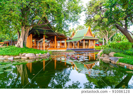 pavilion in Thai style with lake and tree 91086128