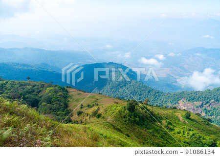 beautiful mountain layer with clouds and blue sky 91086134