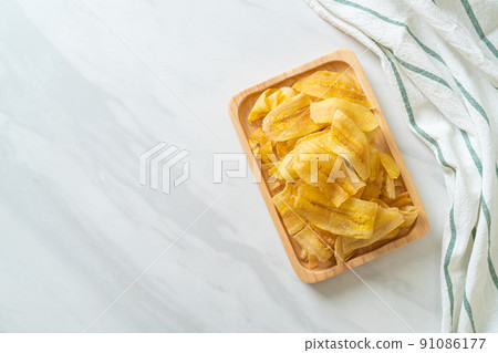 Banana Chips - fried or baked sliced banana 91086177
