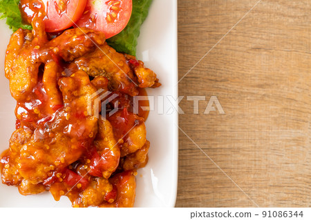 Fried fish topped with 3 flavors chili sauce Fried fish topped with 3 flavors chili sauce 91086344