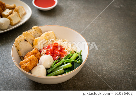 egg noodles with fish balls and shrimp balls in pink sauce, Yen Ta Four or Yen Ta Fo egg noodles with fish balls and shrimp balls in pink sauce, Yen Ta Four or Yen Ta Fo 91086462