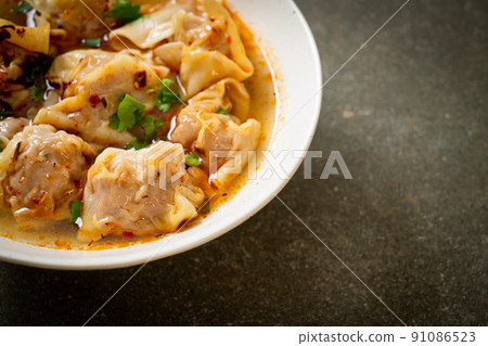 pork wonton soup or pork dumplings soup with roasted chili 91086523
