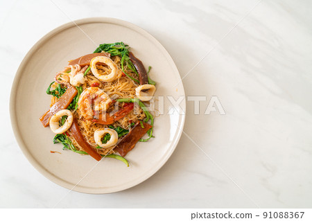 Stir-fried rice vermicelli and water mimosa with mix seafood Stir-fried rice vermicelli and water mimosa with mix seafood 91088367