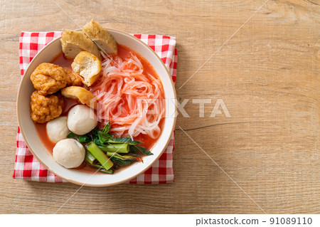 small flat rice noodles with fish balls and shrimp balls in pink soup, Yen Ta Four or Yen Ta Fo 91089110