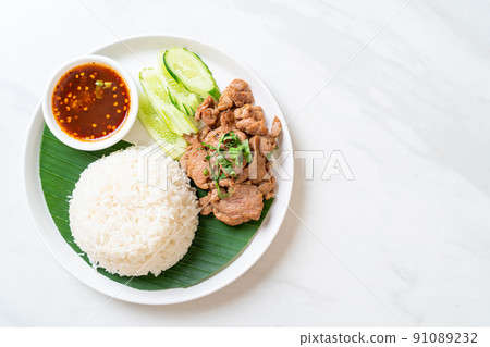 grilled pork garlic with rice with spicy sauce 91089232