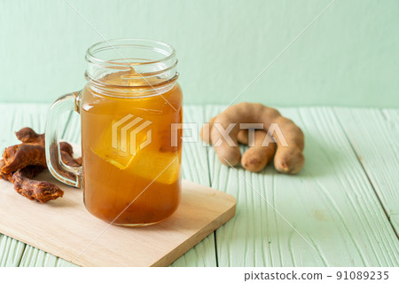 Delicious sweet drink tamarind juice and ice cube Delicious sweet drink tamarind juice and ice cube 91089235