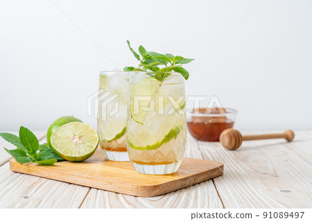iced honey and lime soda with mint iced honey and lime soda with mint 91089497