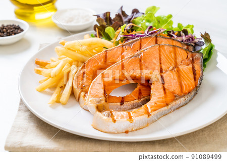 grilled salmon steak fillet with french fries grilled salmon steak fillet with french fries 91089499