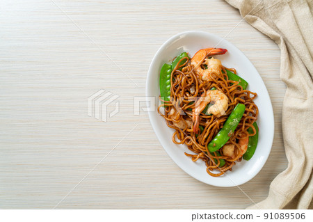 stir-fried yakisoba noodles with green peas and shrimps stir-fried yakisoba noodles with green peas and shrimps 91089506