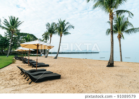 beach chair with palm tree on beach beach chair with palm tree on beach 91089579