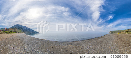 Panoramic View of Cape Ai-Fock, Veselovskaya bay and the beach of the village of Vesyoloe in the Crimea. On the foreground is the western foot of Mount Karaul-Oba. Azure Black Sea near Sudak 91089966