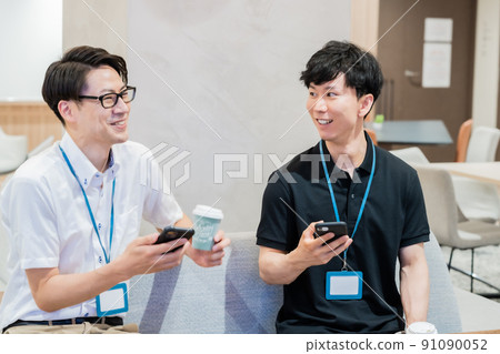 A casual business team chatting while taking a break A casual business team chatting while taking a break 91090052