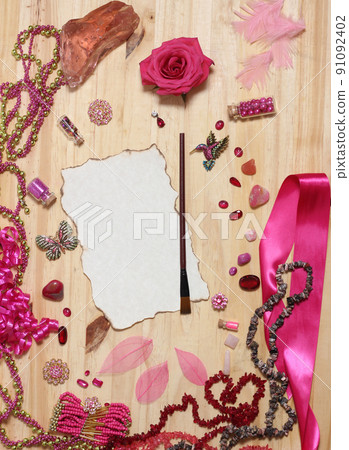 Pink and Magenta Jewelry With Flower and Blank Paper With Burned Edges Pink and Magenta Jewelry With Flower and Blank Paper With Burned Edges 91092402
