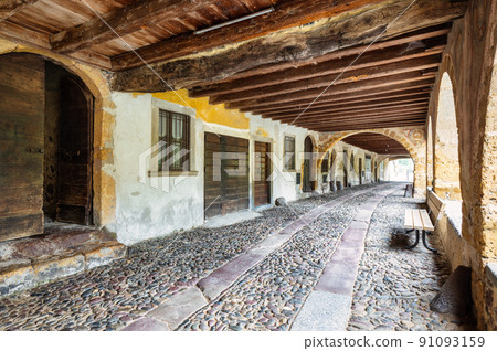 Interior of the historic arcaded street of Averara 91093159