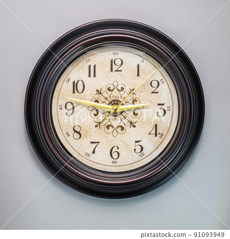 Old wall clock made of wood and iron. The big one was taken out at some point. to see some needles and symbols Focus on some points, cinematic tones, shot in the studio. 91093949