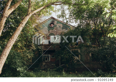 A fire on the roof of an old abandoned building A fire on the roof of an old abandoned building 91095149