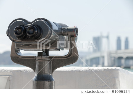 Binocular telescope for tourists mounted in the modern city Binocular telescope for tourists mounted in the modern city 91096124