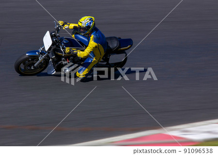 Bike running on the circuit Bike running on the circuit 91096538