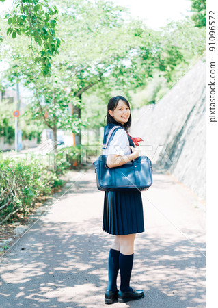 School girls going to school School girls going to school 91096572