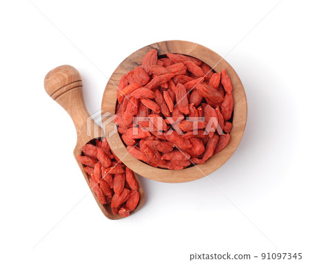Top view of goji berries in wooden bowl and scoop Top view of goji berries in wooden bowl and scoop 91097345
