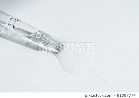 Pipette with fluid serum, oil, face gel cleaner. Cosmetics and healthcare concept closeup. Dose of retinol with air bubbles. Flat lay. Monkeypox, coronavirus research Pipette with fluid serum, oil, face gel cleaner. Cosmetics and healthcare concept closeup. Dose of retinol with air bubbles. Flat lay. Monkeypox, coronavirus research 91097774