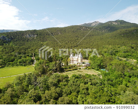Massandra Palace of Emperor Alexander III is located in the Upper Massandra on the southern coast of Crimea. Summer green park museum. Renaissance architectural monument. Manor castle Aerial View 91099032