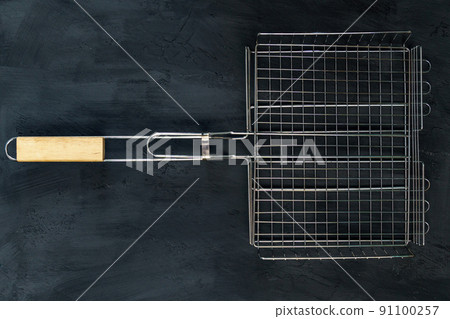 Metal grill for cooking on fire and charcoal. Flat lay. Template for the designer. Metal grill for cooking on fire and charcoal. Flat lay. Template for the designer. 91100257