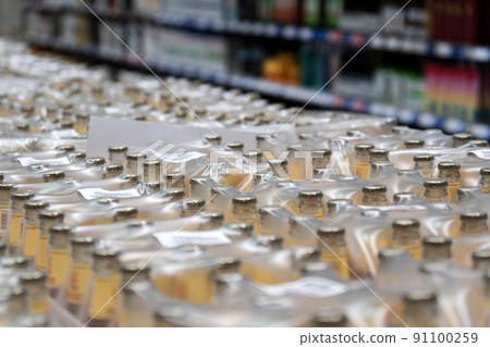 Various alcohol beer packaging boxes that wholesaling on a liquor zone in a supermarket. Selective focus Various alcohol beer packaging boxes that wholesaling on a liquor zone in a supermarket. Selective focus 91100259