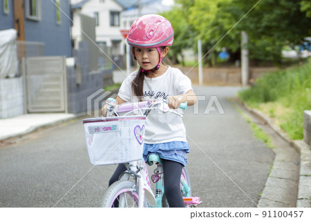Practice riding a bicycle Practice riding a bicycle 91100457