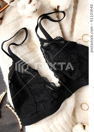 Concept of womens clothes with underwear on gray wooden background Concept of womens clothes with underwear on gray wooden background 91103648