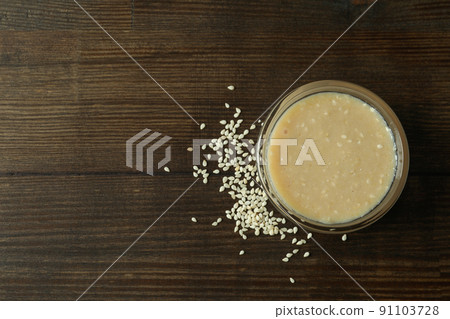 Concept of tasty food with tahini sauce on wooden background Concept of tasty food with tahini sauce on wooden background 91103728