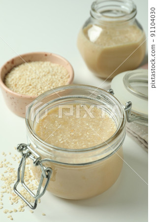 Concept of tasty food with tahini sauce on white background Concept of tasty food with tahini sauce on white background 91104030