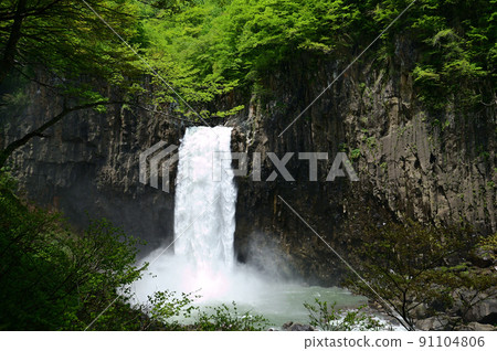 Naena Waterfall Fresh green and the dynamic flow of melting snow 91104806