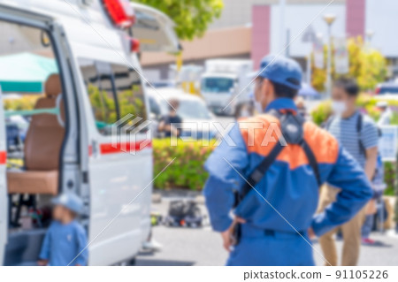 Blurred image of the back of an ambulance and a rescuer 91105226