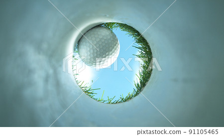Super slow motion of golf ball falls into the hole at the camera, view inside the hole close-up. 91105465