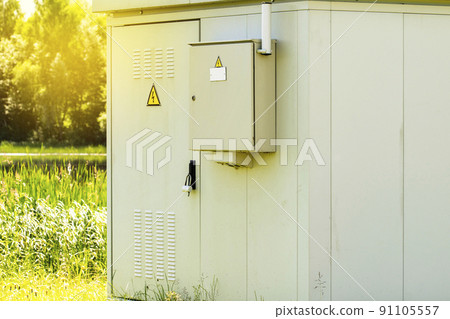 Outdoor electric distribution cabinet with a morning sunlight Outdoor electric distribution cabinet with a morning sunlight 91105557