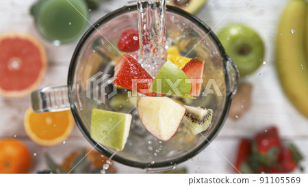 Fresh fruit and vegetables smoothie blended in blender, top view. Healthy eating concept. Fresh fruit and vegetables smoothie blended in blender, top view. Healthy eating concept. 91105569