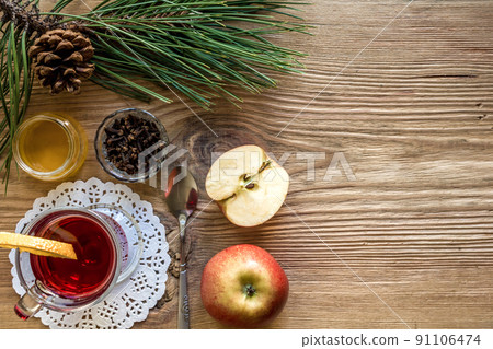 Mulled wine with spices on wooden background 91106474