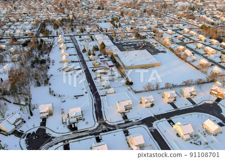Aerial view of the snowfall after severe winter in a small town hometown 91108701