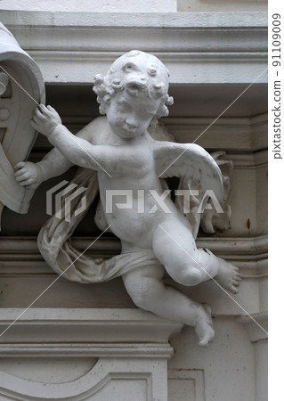Angel, detail from the house of the Knights of the Cross with the Red Star in Vienna 91109009