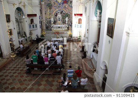Mass for pilgrims in the Catholic Church Saint Eustache in Dobrota, Montenegro Mass for pilgrims in the Catholic Church Saint Eustache in Dobrota, Montenegro 91109415
