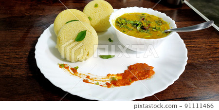 South indian breakfast idli, sambar and coconut chutney South indian breakfast idli, sambar and coconut chutney 91111466