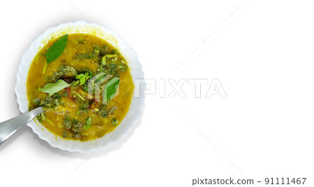 Traditional south indian snack dal sambhar soup with curry leaves Traditional south indian snack dal sambhar soup with curry leaves 91111467