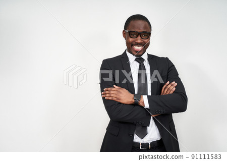 African american businessman standing over white background happy face smiling with crossed arms looking at the camera. Positive person. 91111583