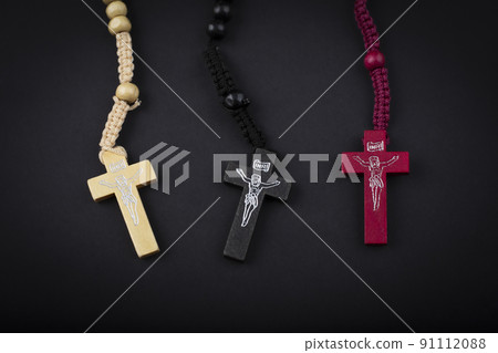 Set of traditional christian holy religious symbol rosary necklace isolated on black background 91112088